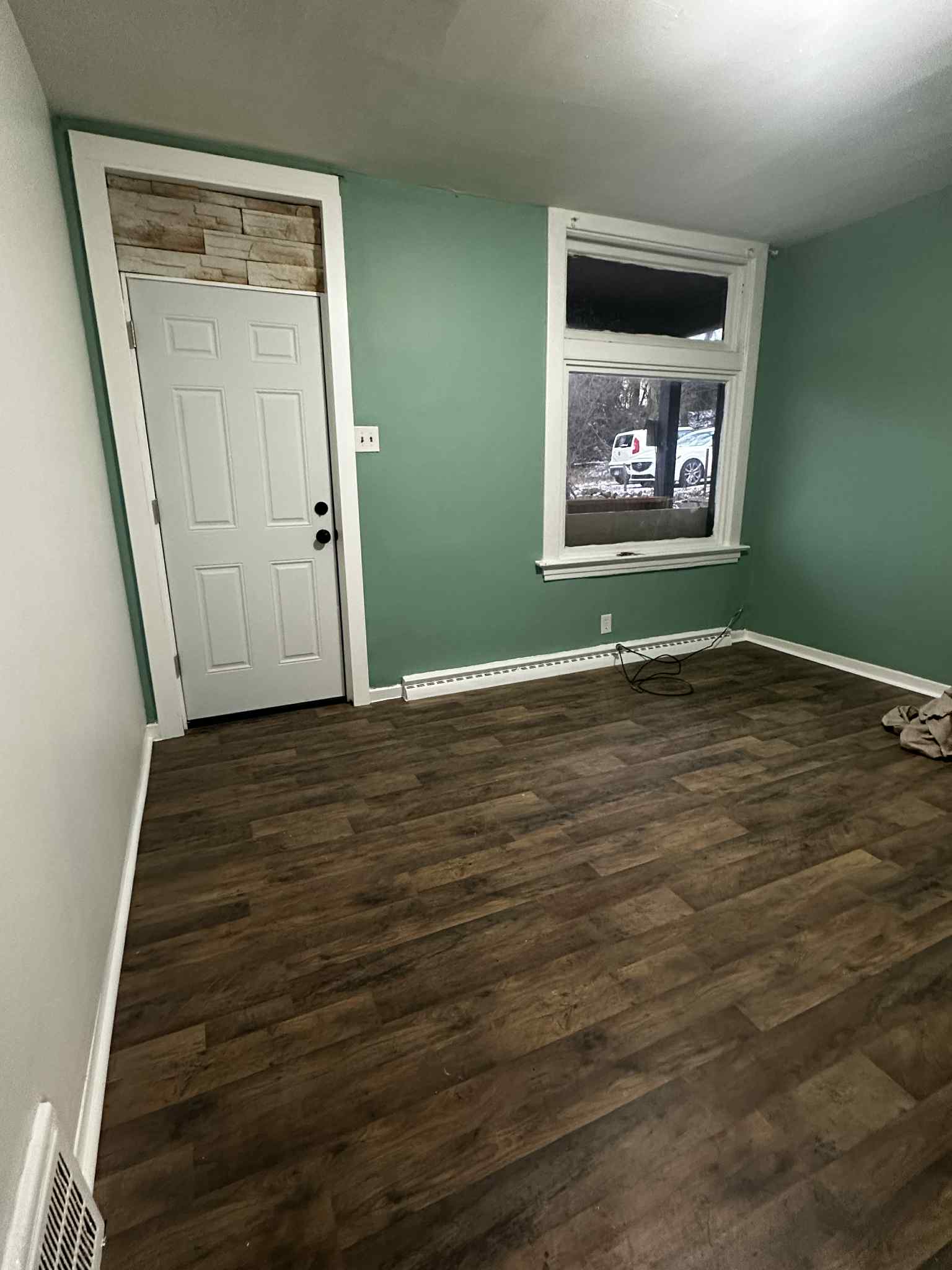 Living Room with Entry Door and New Flooring